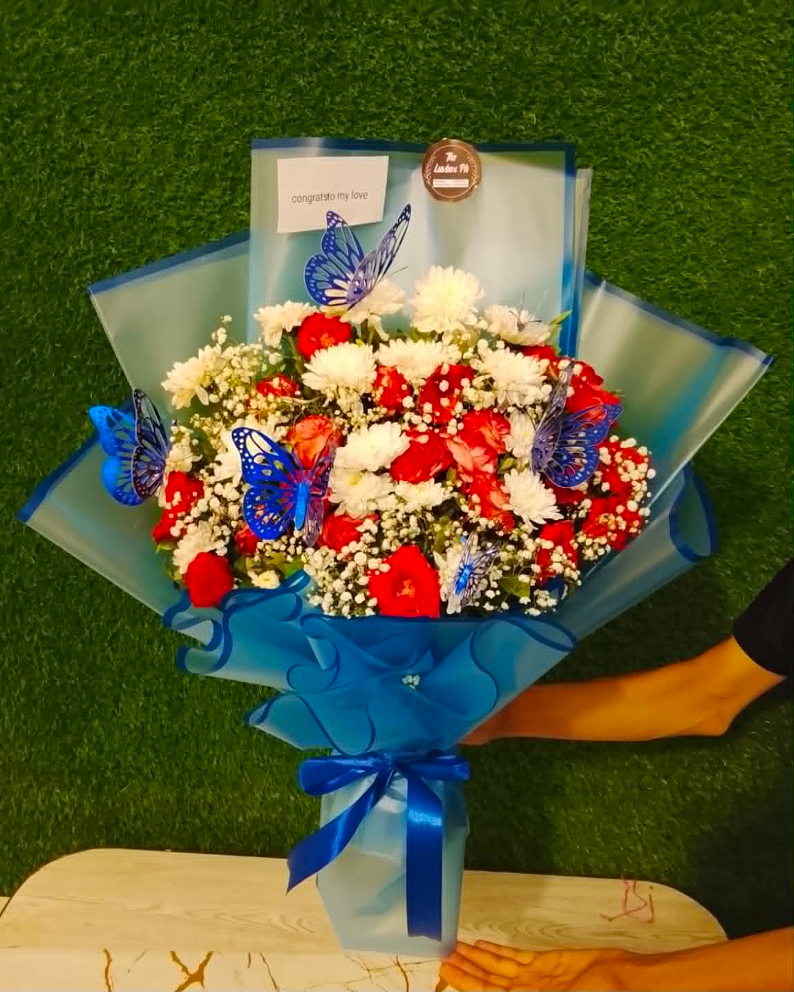 The Noble Gentleman – Signature Blue & Crimson Floral Bouquet
